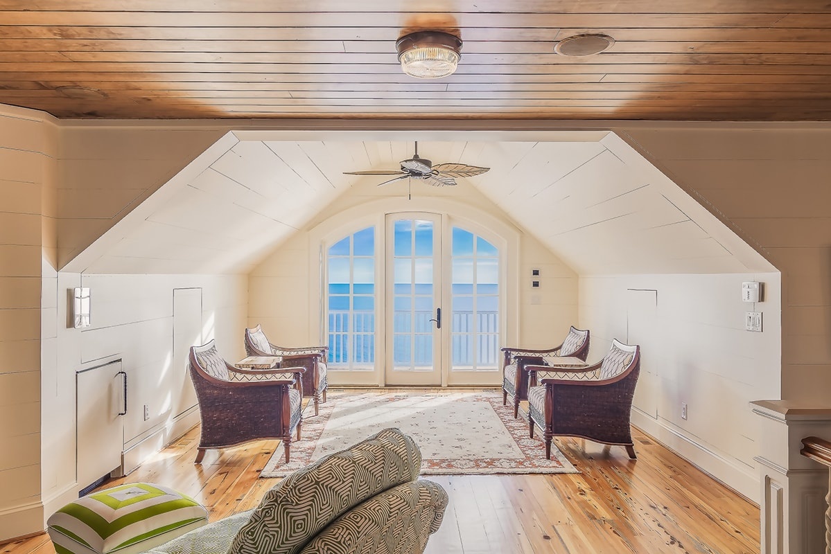 Аttic with armchairs on a wooden floor